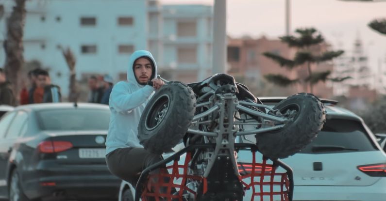 Performance Tires - Man Riding on a Go-kart on an Asphalt Road at Dusk