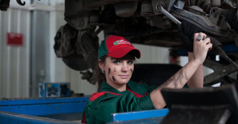 Oil Change - Woman Holding Gray Steel Wrench