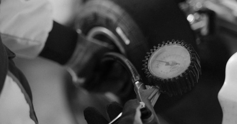 Tire Pressure - Checking Kart Tire Pressure in Black and White