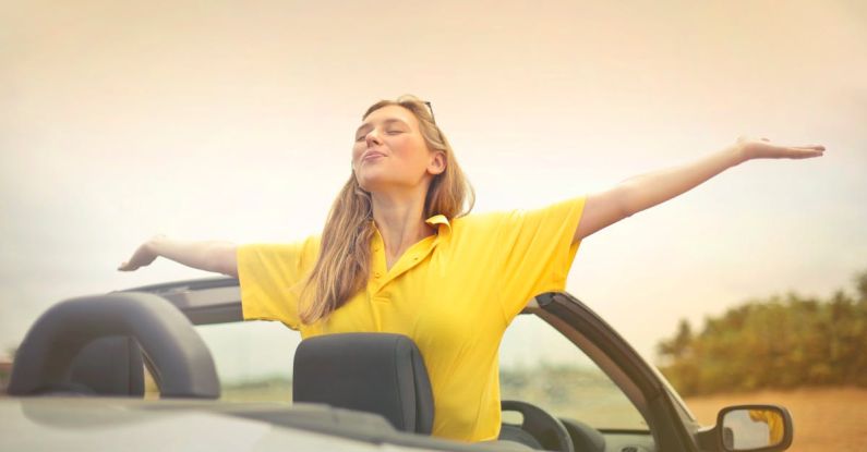 New Car - Woman Sitting on Car Under Gray Sky