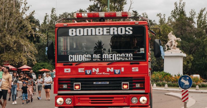 Emergency Braking - A red fire truck driving down a street