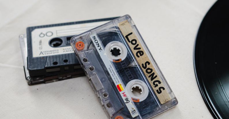 Compact Vs. Midsize - White and Blue Cassette Tape