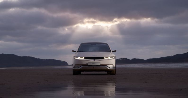 Hyundai Kona Electric - Front View of White Hyundai Car on Wet Road