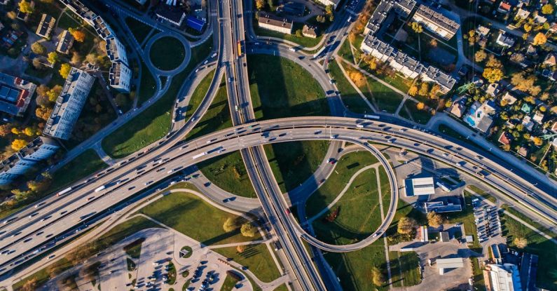 Connected Car - Aerial Photo of Buildings and Roads