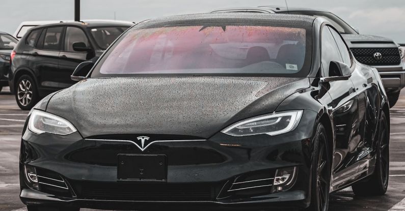 Tesla Model S - View of a Black Tesla Model S on a Parking Lot